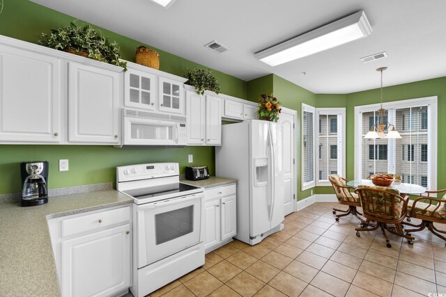 2180 Waterview Dr Unit 632, North Myrtle Beach, SC 29582 - kitchen featuring white cabinetry, white appliances, and visible vents