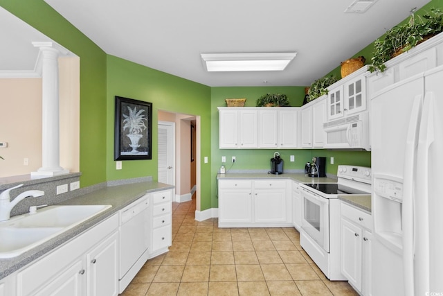 2180 Waterview Dr Unit 632, North Myrtle Beach, SC 29582 - kitchen with white appliances, light tile patterned floors, white cabinets, ornate columns, and a sink