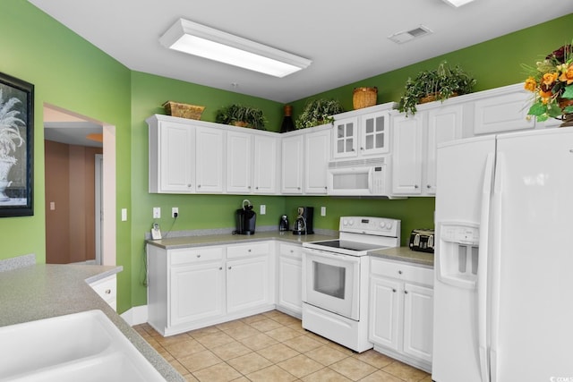 2180 Waterview Dr Unit 632, North Myrtle Beach, SC 29582 - kitchen with visible vents, light countertops, white appliances, white cabinetry, and light tile patterned flooring