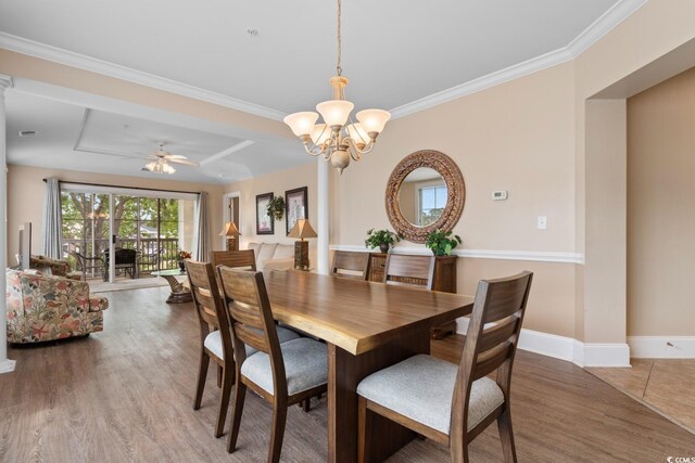 2180 Waterview Dr Unit 632, North Myrtle Beach, SC 29582 - dining area featuring crown molding, baseboards, a chandelier, and light wood-style floors