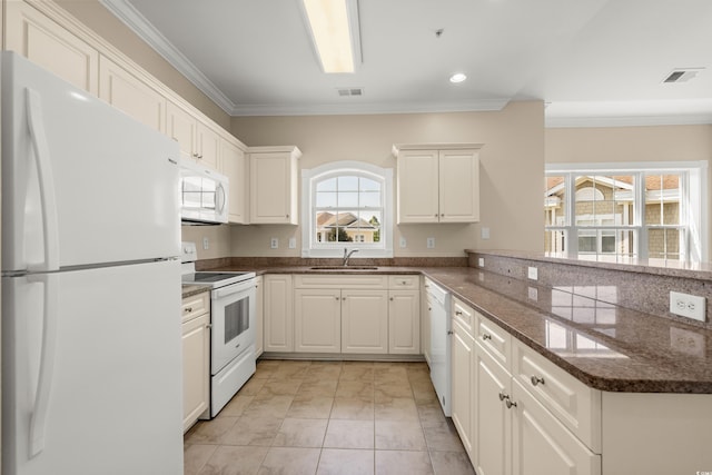 117 S Shore Blvd Unit 301, Longs, SC 29568 - kitchen featuring white appliances, a peninsula, ornamental molding, dark stone counters, and white cabinets