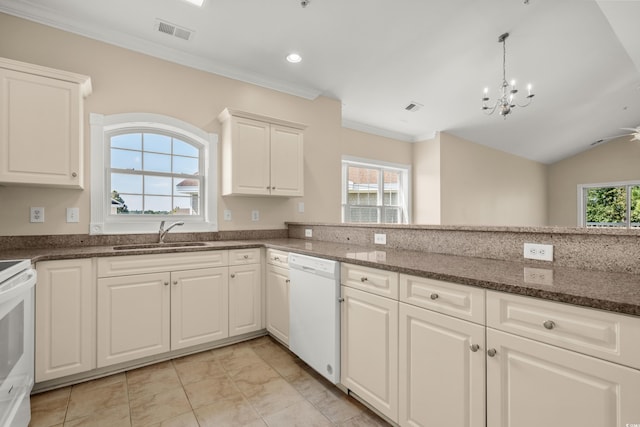 117 S Shore Blvd Unit 301, Longs, SC 29568 - kitchen featuring white appliances, a chandelier, dark stone countertops, white cabinetry, and vaulted ceiling