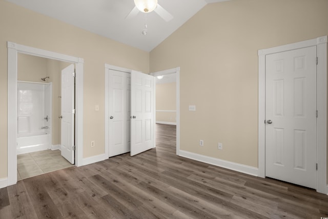 117 S Shore Blvd Unit 301, Longs, SC 29568 - unfurnished bedroom with wood finished floors, ensuite bathroom, high vaulted ceiling, and ceiling fan