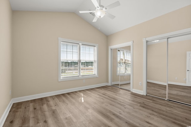 117 S Shore Blvd Unit 301, Longs, SC 29568 - unfurnished bedroom with multiple closets, wood finished floors, lofted ceiling, and ceiling fan