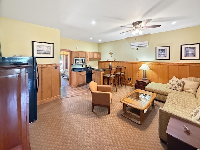 147 Brown Pelican Loop, Pawleys Island, SC 29585 - living area with a wall mounted AC, light carpet, ceiling fan, a wainscoted wall, and recessed lighting
