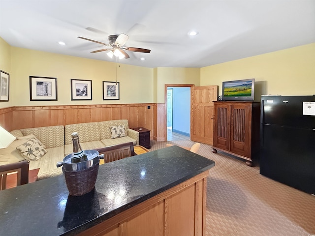 147 Brown Pelican Loop, Pawleys Island, SC 29585 - living area with ceiling fan, light carpet, a wainscoted wall, and recessed lighting