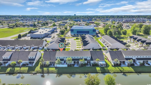 birds eye view of property featuring a water view and a residential view