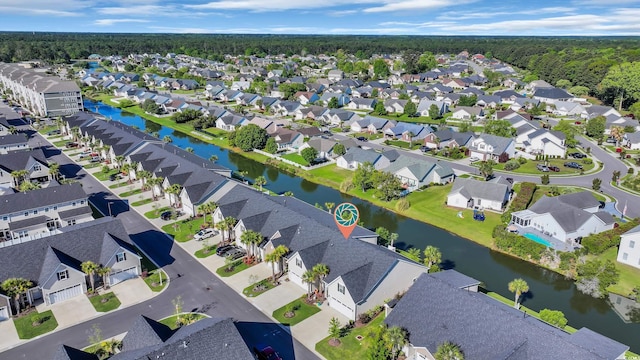 aerial view featuring a residential view and a water view