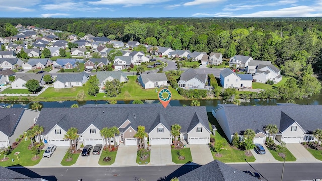 birds eye view of property with a residential view, a water view, and a forest view