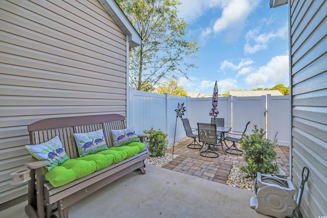 view of patio with outdoor lounge area, outdoor dining area, and a fenced backyard