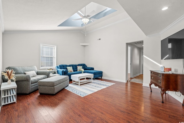 living room with a ceiling fan, visible vents, wood finished floors, baseboards, and ornamental molding