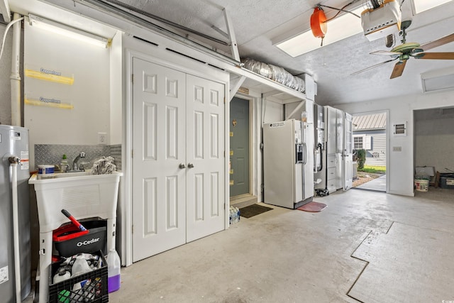 interior space featuring concrete floors and water heater