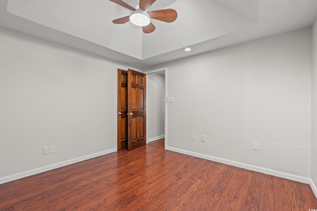 unfurnished room with recessed lighting, a ceiling fan, baseboards, and wood finished floors
