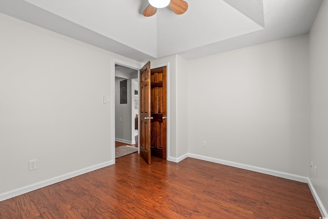 spare room with baseboards, a ceiling fan, and wood finished floors
