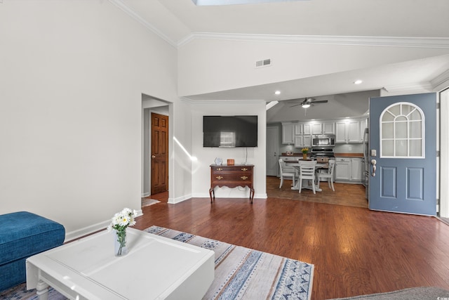living room featuring visible vents, crown molding, dark wood finished floors, baseboards, and high vaulted ceiling