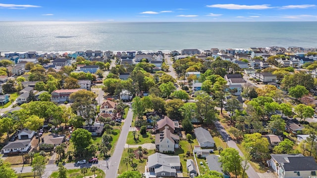 birds eye view of property with a water view and a residential view
