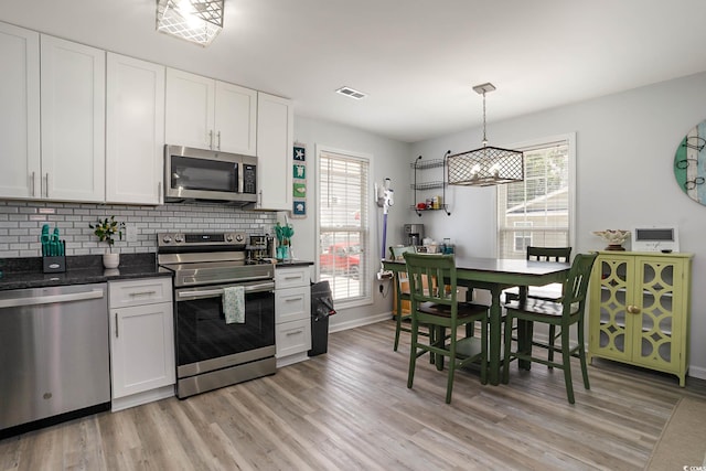 6001-5417 S Kings Hwy, Myrtle Beach, SC 29575 - kitchen with stainless steel appliances, light wood-style floors, and healthy amount of natural light