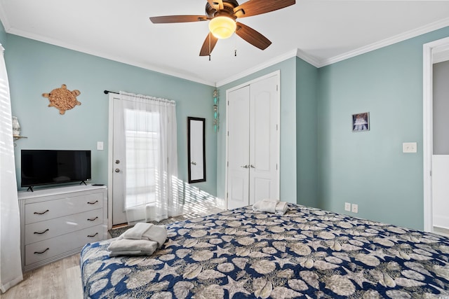 304 S Hillside Dr Unit B, North Myrtle Beach, SC 29582 - bedroom featuring a closet, ornamental molding, a ceiling fan, and wood finished floors