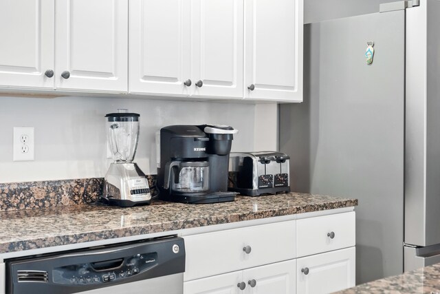 304 S Hillside Dr Unit B, North Myrtle Beach, SC 29582 - kitchen featuring dark stone countertops, white cabinets, freestanding refrigerator, and dishwasher