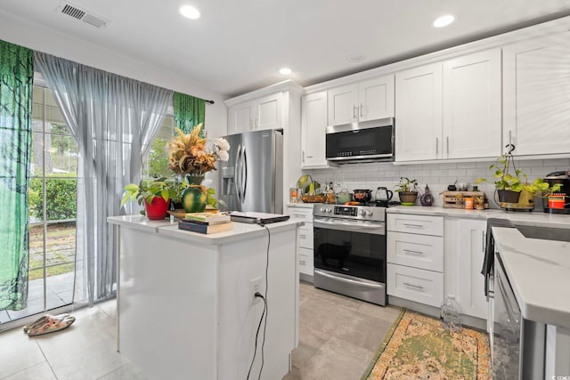 3564 Evergreen Way Unit 3564, Myrtle Beach, SC 29577 - kitchen featuring stainless steel appliances, tasteful backsplash, white cabinets, a kitchen island, and recessed lighting