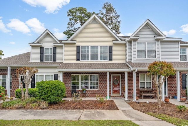3564 Evergreen Way Unit 3564, Myrtle Beach, SC 29577 - townhome / multi-family property with a shingled roof and brick siding