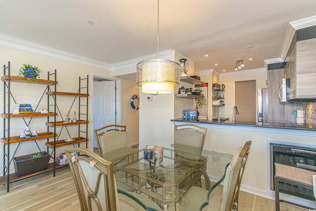 4560 Greenbriar Dr Unit 306B, Little River, SC 29566 - dining area with light wood-style floors, ornamental molding, baseboards, and recessed lighting