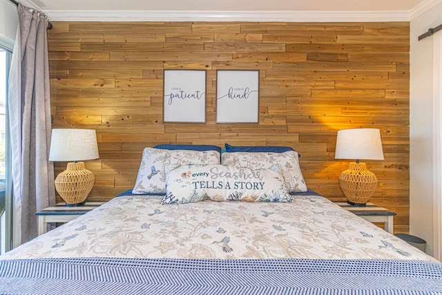 4560 Greenbriar Dr Unit 306B, Little River, SC 29566 - bedroom featuring ornamental molding, wooden walls, and a barn door