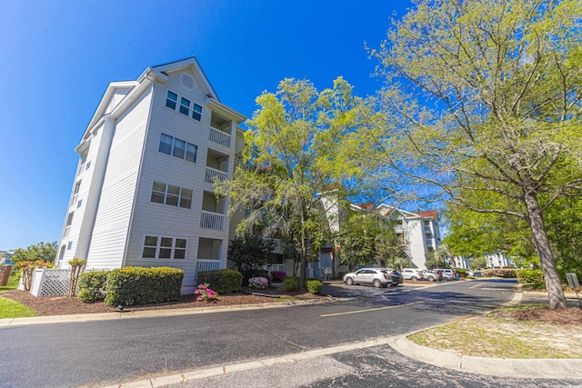 4560 Greenbriar Dr Unit 306B, Little River, SC 29566 - view of building exterior with uncovered parking