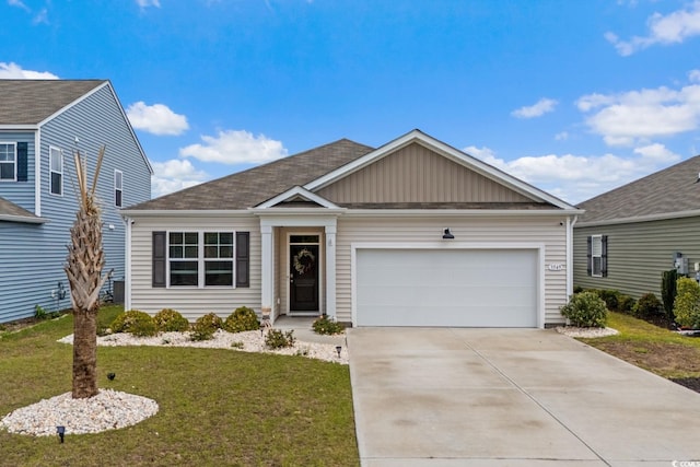view of front of property featuring a garage, board and batten siding, a front lawn, and concrete driveway