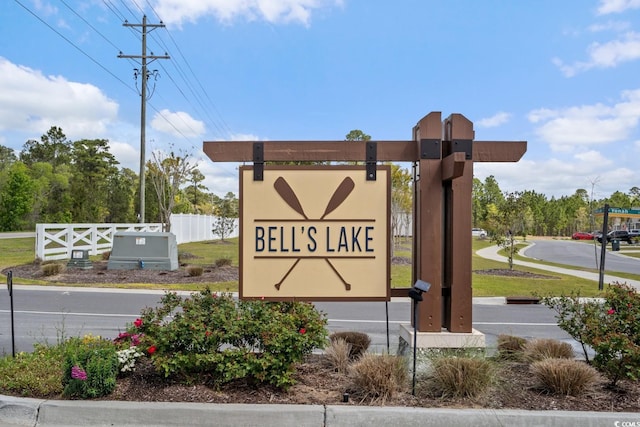 community sign with fence