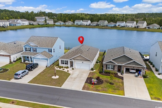aerial view featuring a residential view and a water view