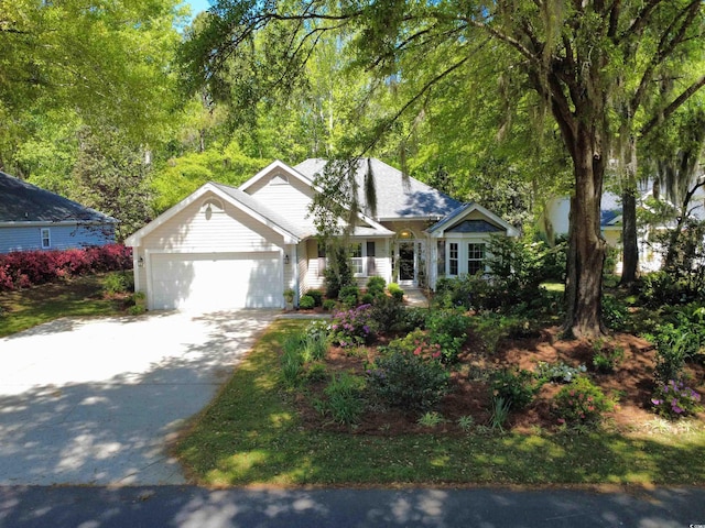single story home featuring an attached garage and concrete driveway