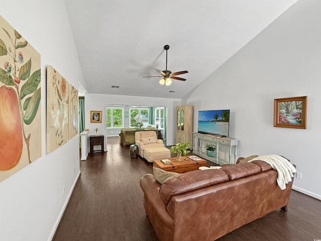 living room featuring wood finished floors, visible vents, a ceiling fan, baseboards, and high vaulted ceiling