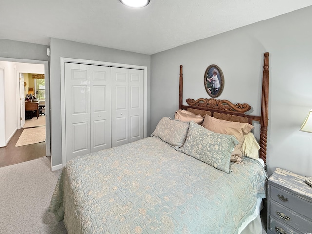 carpeted bedroom featuring a closet