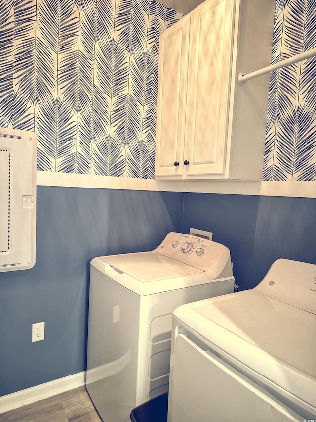 897 Wild Leaf Loop, Conway, SC 29526 - washroom featuring separate washer and dryer, cabinet space, and wood finished floors