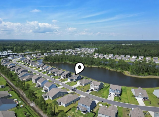 aerial view of property's location with a nearby body of water and nearby suburban area