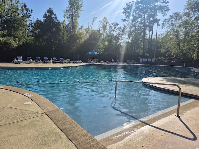 community pool featuring a patio area