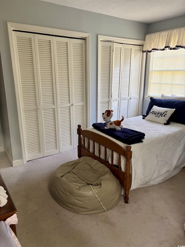 116 Green Lake Dr, Myrtle Beach, SC 29572 - carpeted bedroom featuring two closets