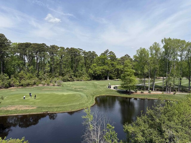 5001 Little River Rd Unit 501E, Myrtle Beach, SC 29577 - surrounding community featuring a water view, view of golf course, a lawn, and view of scattered trees