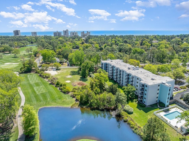 5001 Little River Rd Unit 501E, Myrtle Beach, SC 29577 - bird's eye view of a nearby body of water, apartment complex, a local golf course, and a tree filled landscape