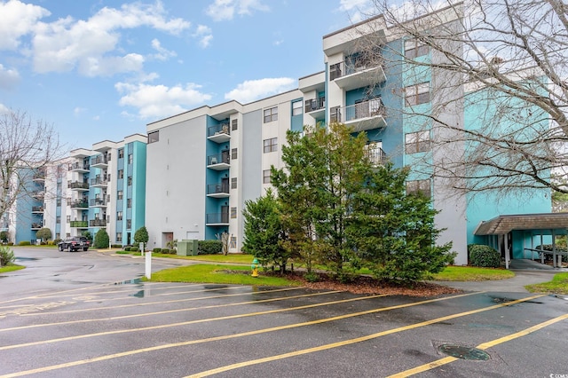 5001 Little River Rd Unit 501E, Myrtle Beach, SC 29577 - view of apartment building / complex featuring uncovered parking