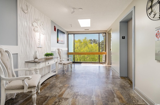 5001 Little River Rd Unit 501E, Myrtle Beach, SC 29577 - hall featuring elevator, expansive windows, and baseboards