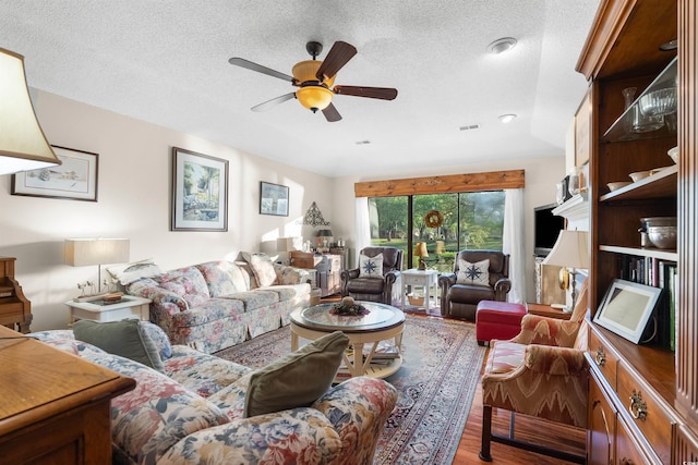 111 Cedar Ridge Ln, Conway, SC 29526 - living area with wood finished floors, a ceiling fan, and a textured ceiling