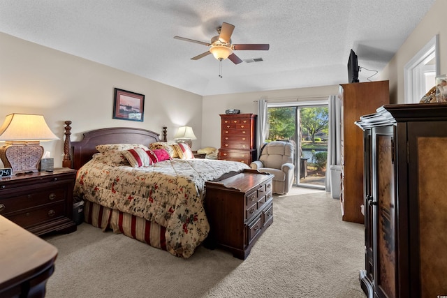 111 Cedar Ridge Ln, Conway, SC 29526 - bedroom with access to exterior, light carpet, a textured ceiling, and a ceiling fan