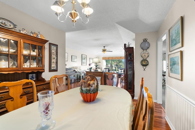111 Cedar Ridge Ln, Conway, SC 29526 - dining area featuring wood finished floors, a chandelier, a textured ceiling, and ceiling fan