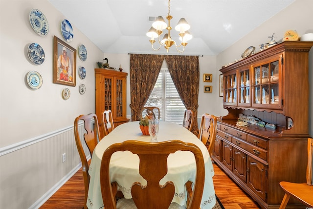 111 Cedar Ridge Ln, Conway, SC 29526 - dining space with a chandelier, light wood-type flooring, lofted ceiling, and wainscoting