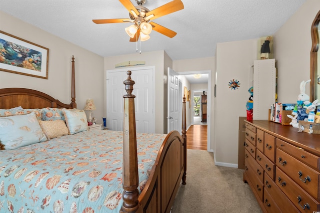 111 Cedar Ridge Ln, Conway, SC 29526 - bedroom with light colored carpet, ceiling fan, a closet, a textured ceiling, and baseboards