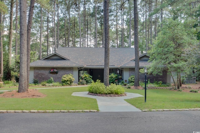 111 Cedar Ridge Ln, Conway, SC 29526 - mid-century inspired home with a front lawn, a shingled roof, and brick siding
