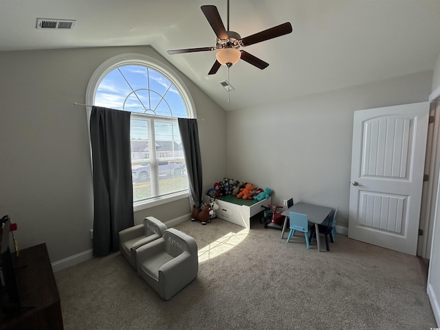 sitting room featuring vaulted ceiling, ceiling fan, carpet floors, and baseboards