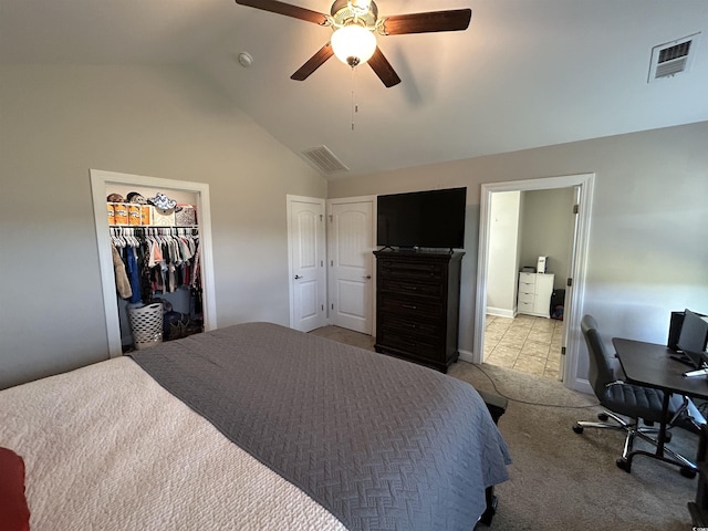 carpeted bedroom featuring lofted ceiling, a ceiling fan, tile patterned floors, and a desk